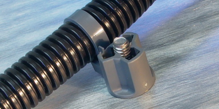 1999 Stud Mount Tie secures tubing