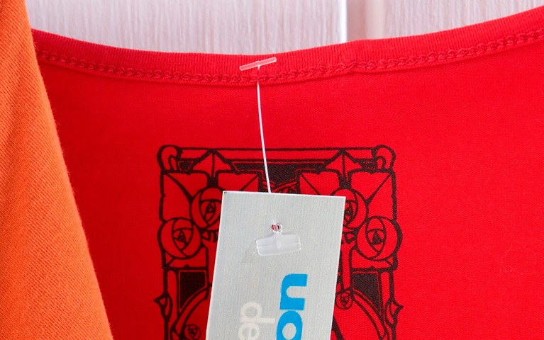 Swiftach Retail Clothing Tag on Red Shirt